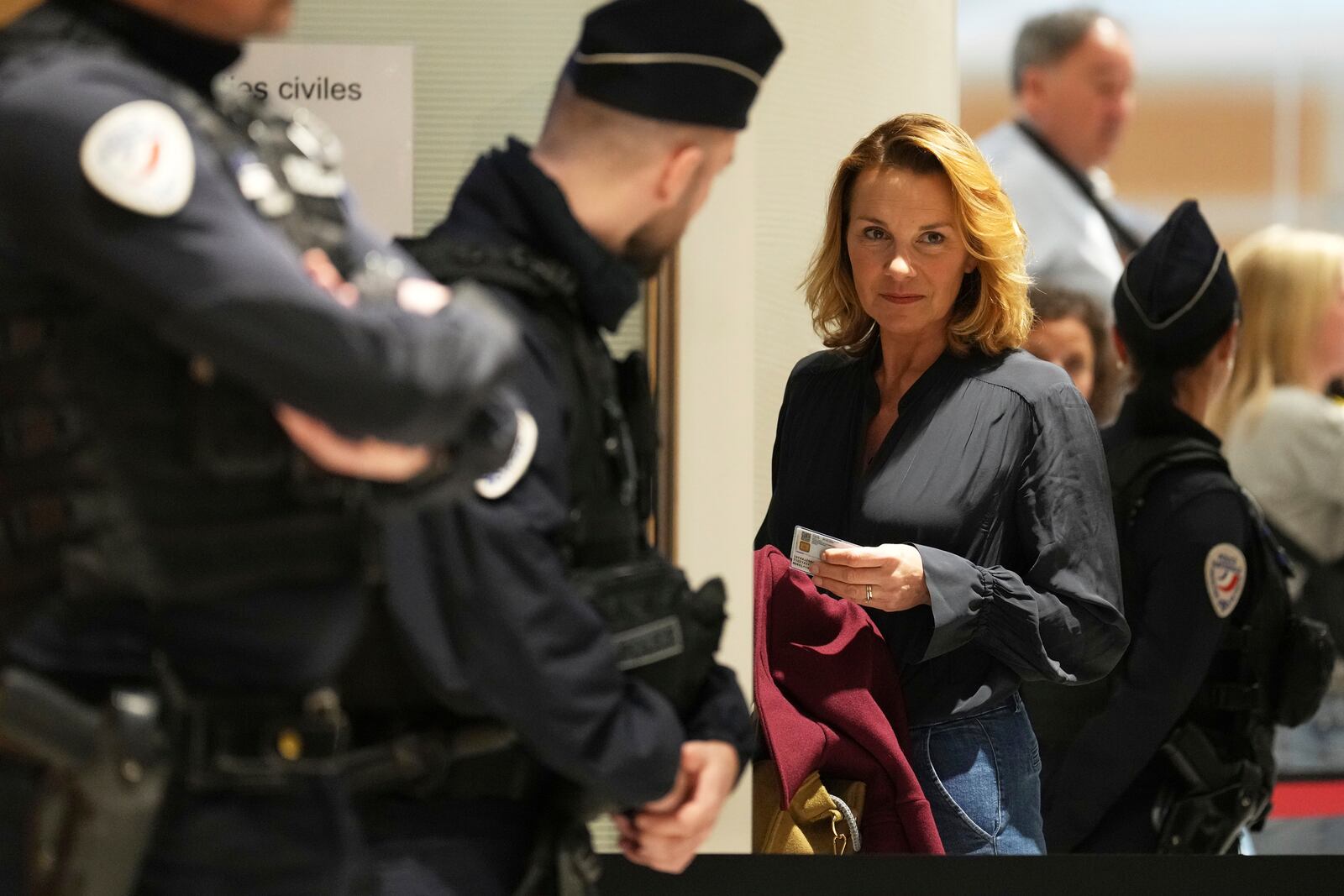 A plaintiff arrives as actor Gerard Depardieu face his trial for the alleged sexual assaults of two women on a film set in 2021, with his lawyer Jeremie Assous ,Tuesday, March 25, 2025 in Paris. (AP Photo/Aurelien Morissard)