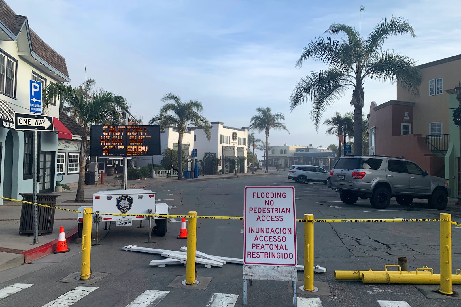 A street is closed due to high surf conditions near Capitola Beach, Monday, Dec. 23, 2024, in Capitola, Calif. (AP Photo/Pamela Hassell)