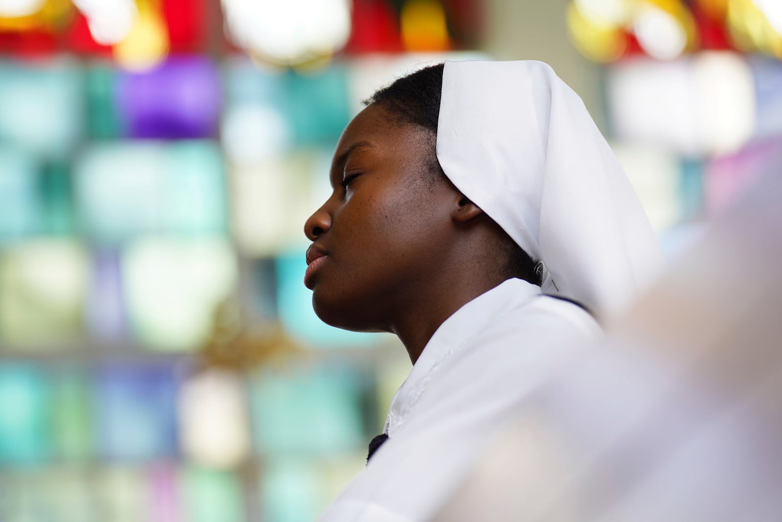 Sister Seyram Mary Adzokpa of the Sisters of the Holy Family prays the rosary in the chapel of the motherhouse in New Orleans, Tuesday, June 25, 2024. (AP Photo/Jessie Wardarski)