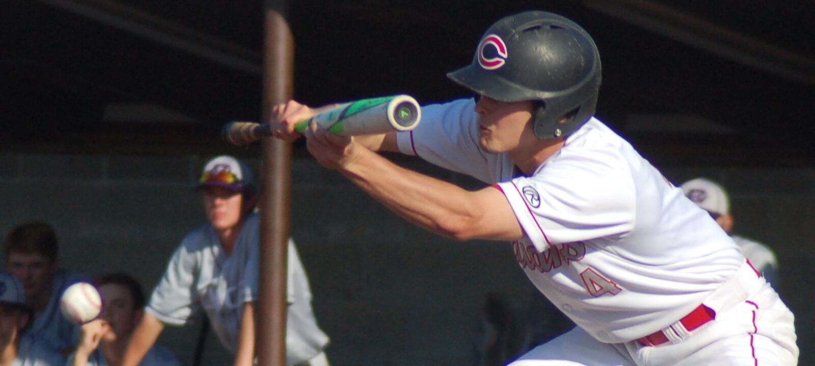 Carlisle’s Adam Goodpaster puts down a bunt Friday during a Division III regional final against Cincinnati Hills Christian Academy at the Athletes in Action complex in Xenia. CONTRIBUTED PHOTO BY JOHN CUMMINGS