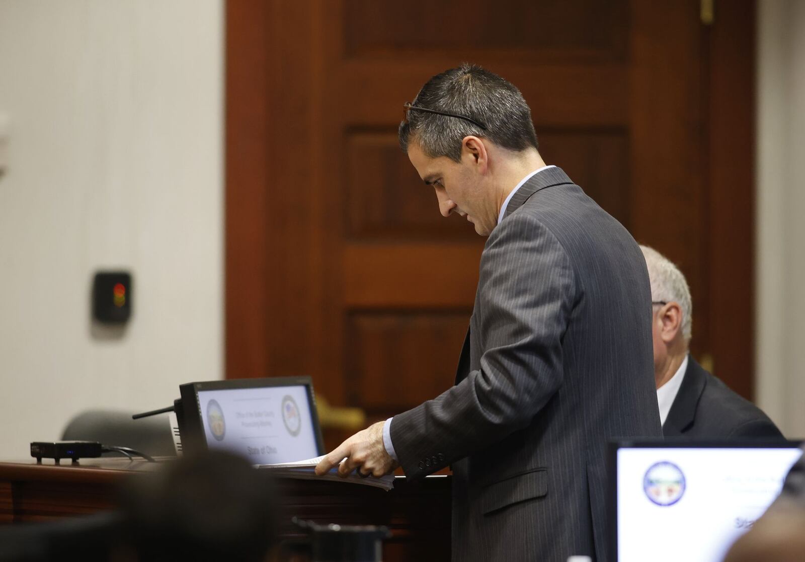 Assistant Prosecutor Josh Muennich prepares to question a witness in the Gurpreet Singh death penalty trial Friday, Oct. 14 in Butler County Common Pleas Court. NICK GRAHAM/STAFF