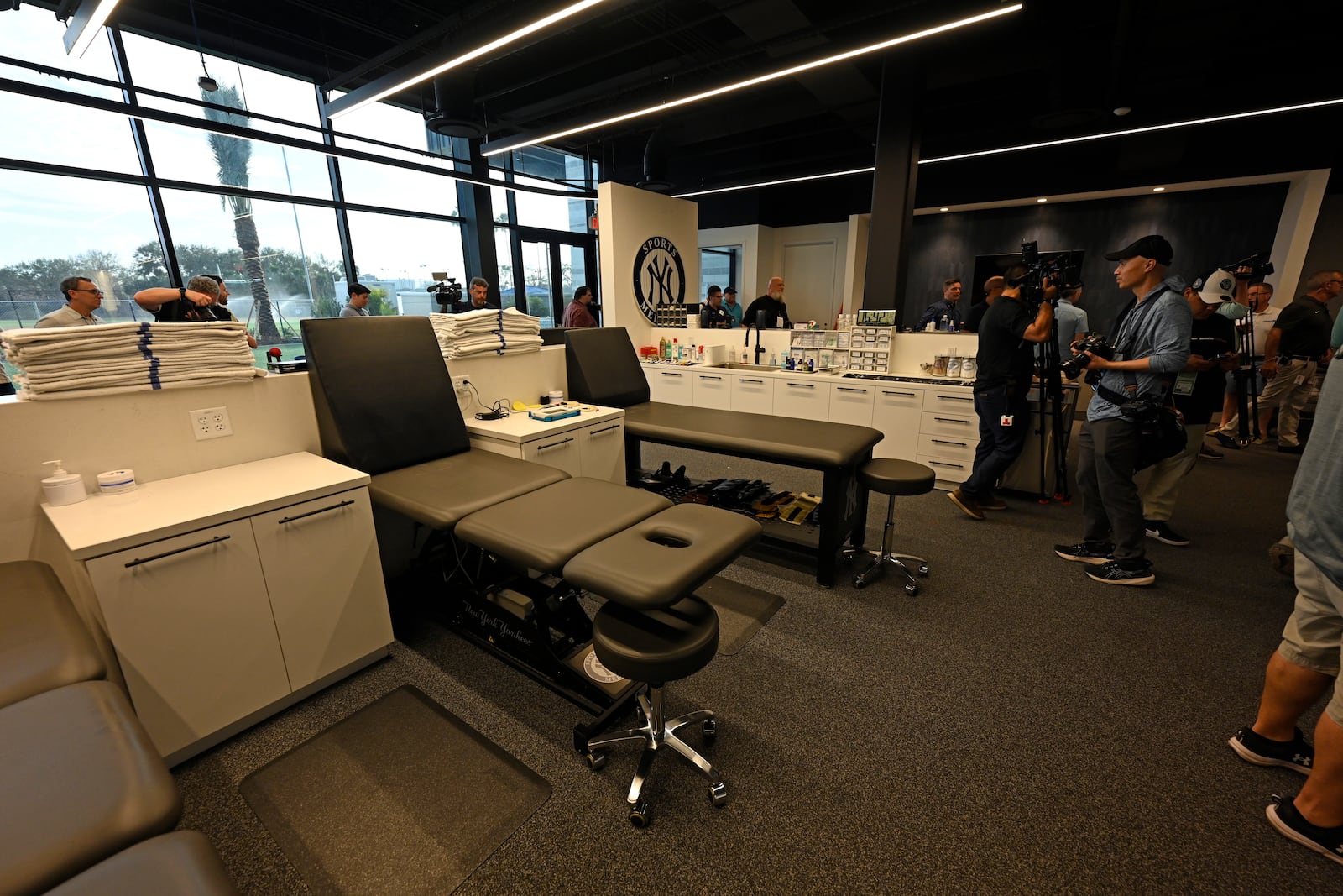 Members of the media walk through the New York Yankees medical and training room during a tour of the upgraded team spring training facilities Thursday, Feb. 13, 2025, at George M. Steinbrenner Field in Tampa, Fla. (AP Photo/Steve Nesius)