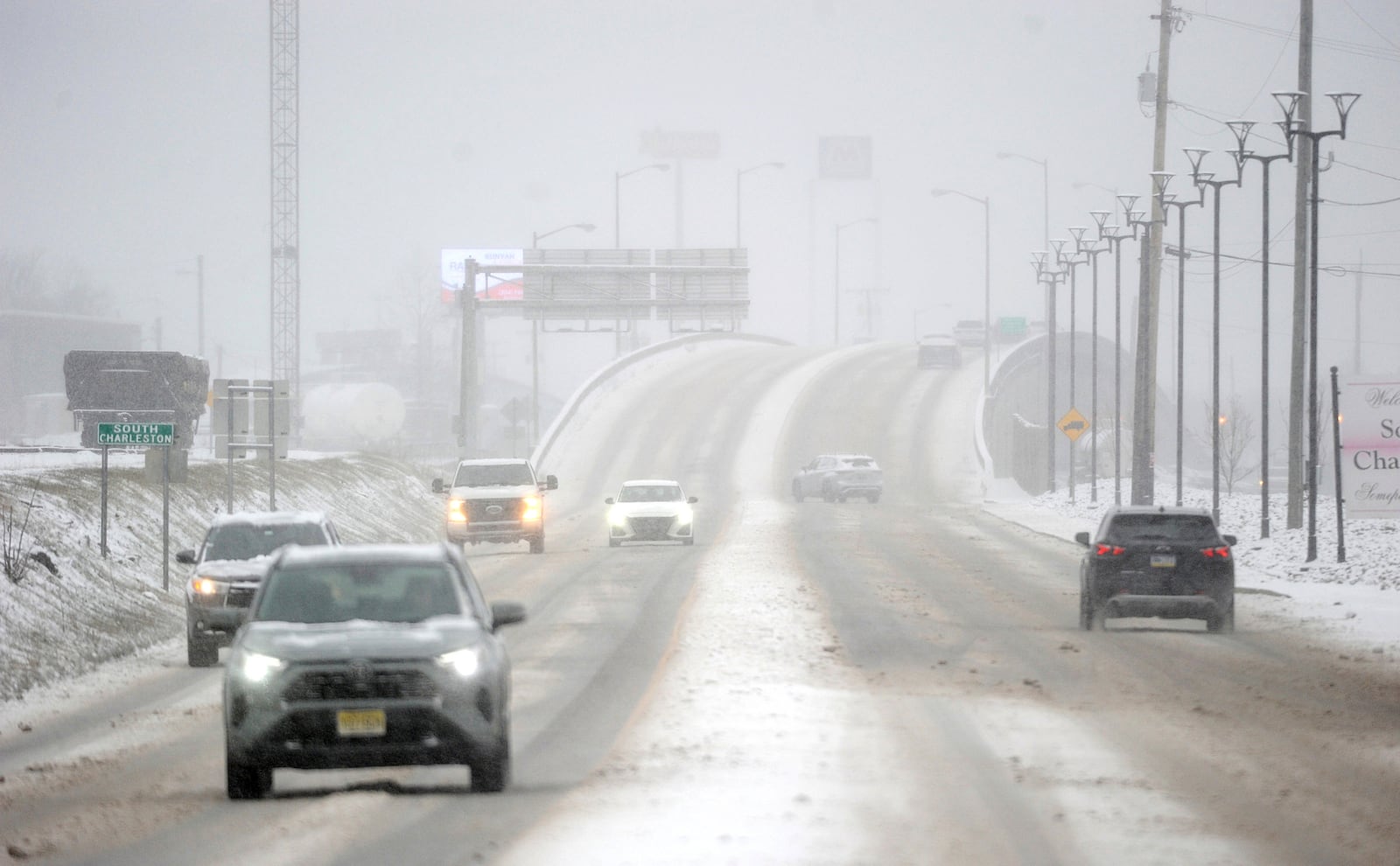 Traffic crawls along MacCorkle Avenue at the city line between Charleston and South Charleston, W.Va., Wednesday, Feb. 19, 2025. (Christopher Millette/Charleston Gazette-Mail via AP)