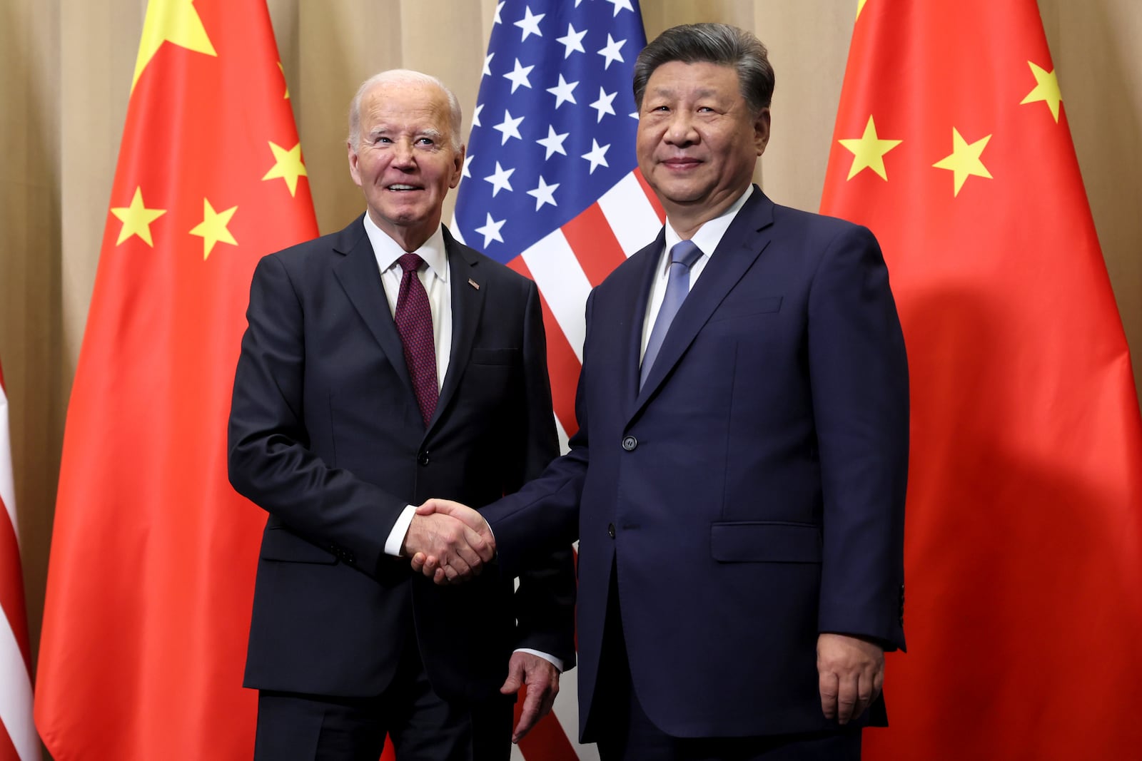 President Joe Biden shakes hands with Chinese President Xi Jinping before a bilateral meeting, Saturday, Nov. 16, 2024, in Lima, Peru. (Leah Millis/Pool Photo via AP)