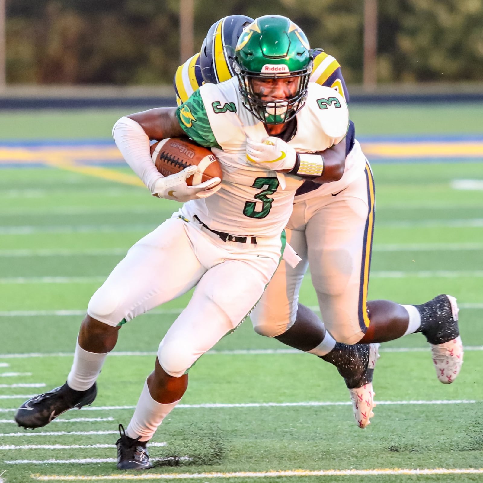 Northmont High School receiver Markus Allen is tackled by Springfield’s Bryce Walker during a game last season in Springfield. CONTRIBUTED PHOTO BY MICHAEL COOPER