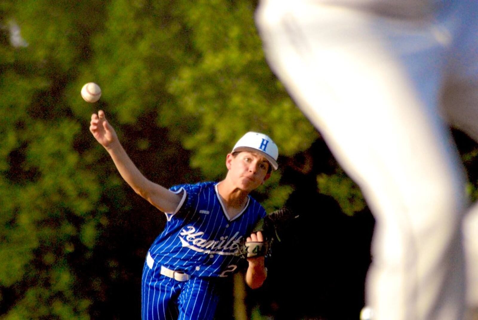 Hamilton West Side's Ethan Woods (2) sends a pitch to the plate against Lebanon on Wednesday. Chris Vogt/CONTRIBUTED