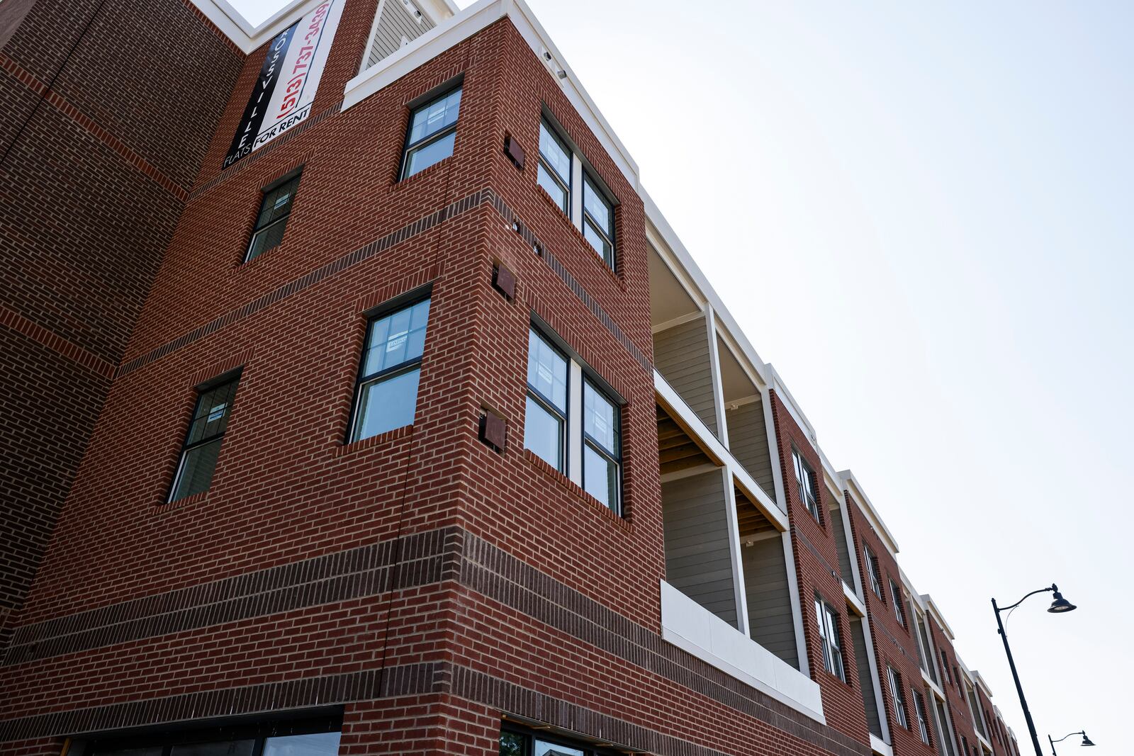 Construction continues on the Rossville Flats apartments with street level retail space on Main Street in Hamilton. NICK GRAHAM/STAFF