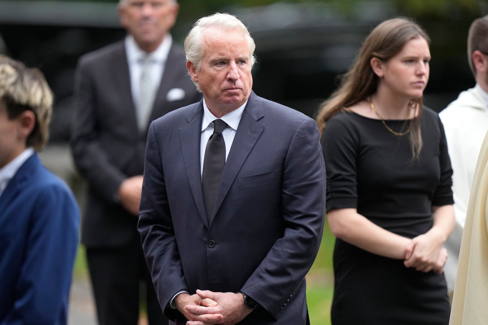 Chris Kennedy, center, son of Ethel Kennedy, departs Our Lady of Victory church following funeral services for Ethel Kennedy, Monday, Oct. 14, 2024, in Centerville, Mass. (AP Photo/Steven Senne)