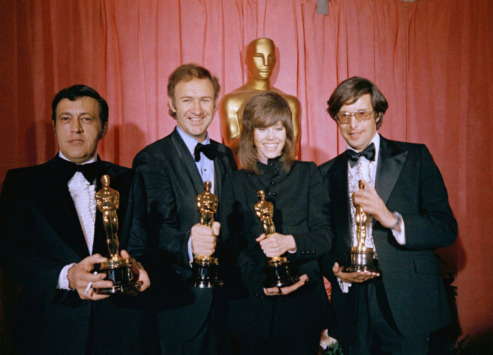 FILE - Philip D'Antoni producer of the "The French Connection", named best picture; Gene Hackman named "best actor" for his role in "The French Connection"; Jane Fonda named "best actress" for "Klute" and William Friedkin, winner of "best achievement in directing" for "The French Connection," pose for a photo, at the Academy Awards, March 27, 1971 at the Dorothy Chandler Pavilion, Los Angeles. (AP Photo, File)