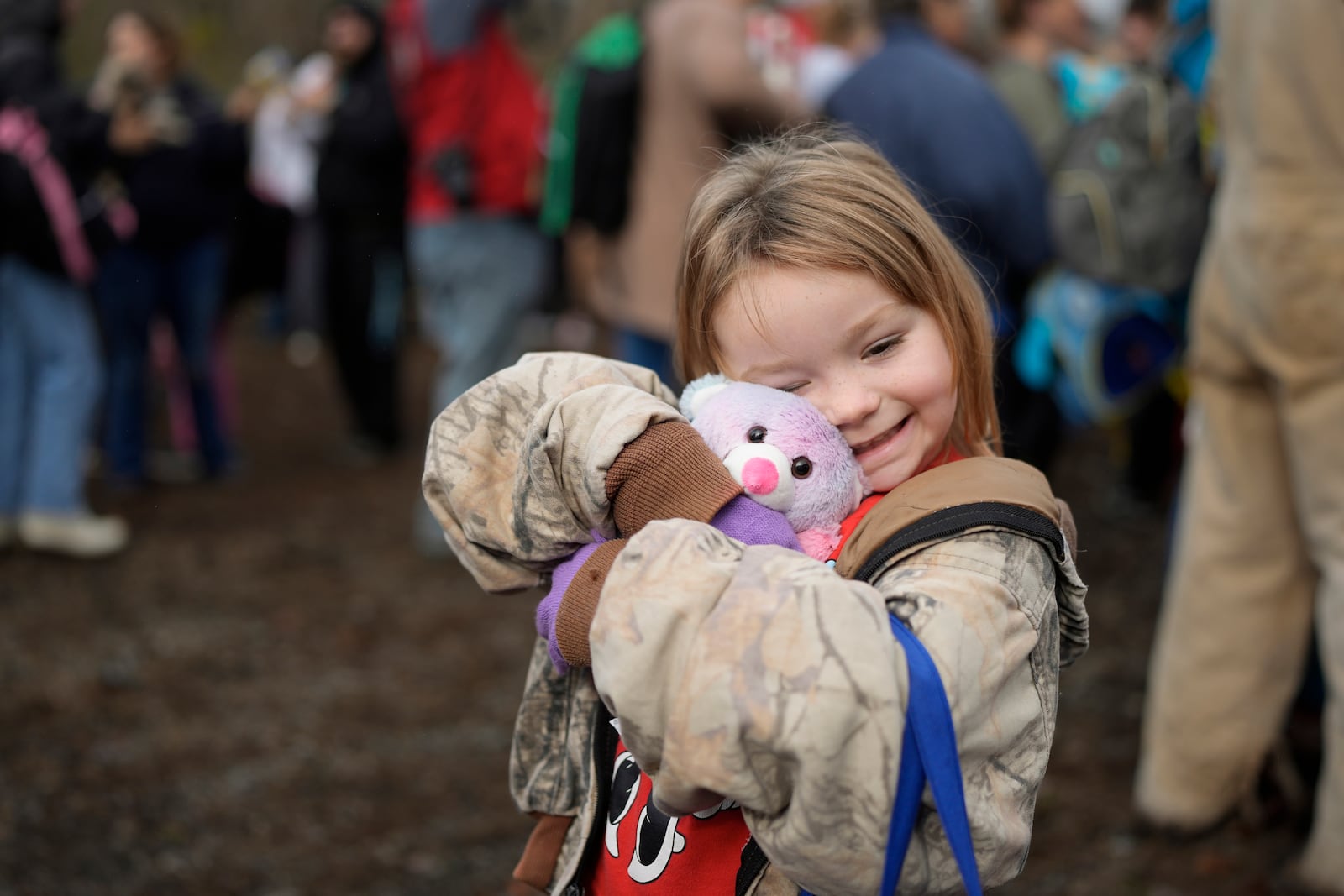 Brooklyn McCoy reacts to a gift she received during the 82nd run of the CSX Santa Train, Saturday, Nov. 23, 2024, in Dungannon, Va. (AP Photo/George Walker IV)