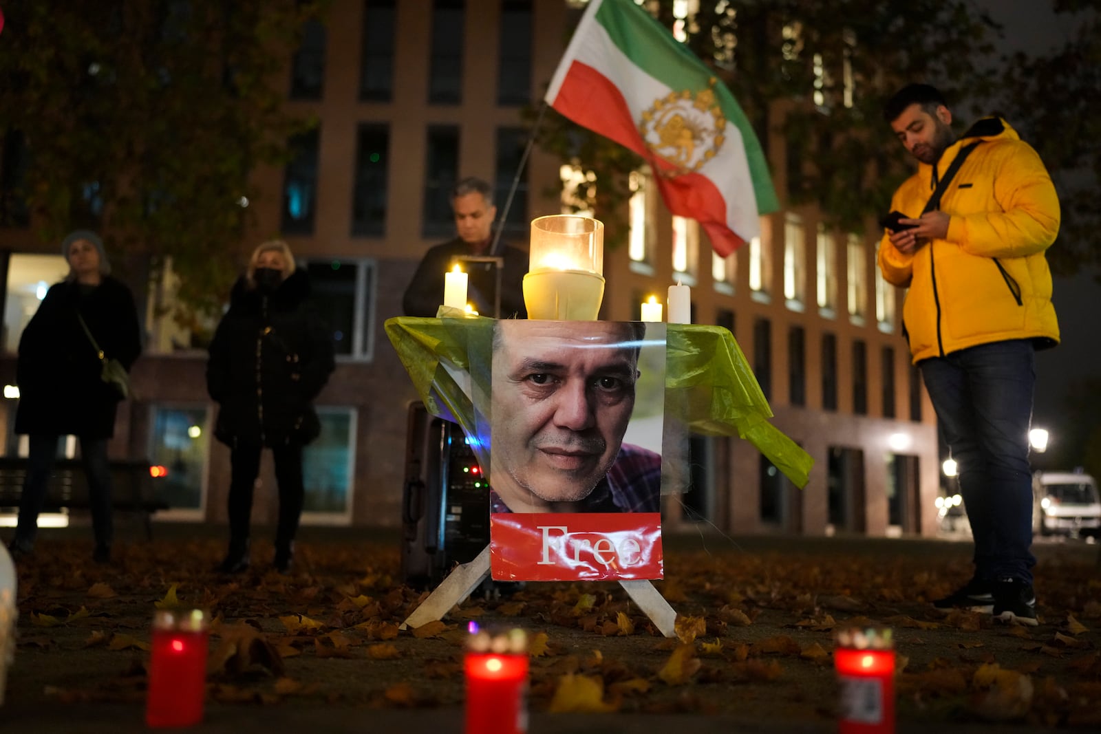 People commemorate Iranian-German Jamshid Sharmahd during a protest following his execution in Iran, near the Foreign Ministry in Berlin, Germany, Monday, Oct. 28, 2024. (AP Photo/Markus Schreiber)