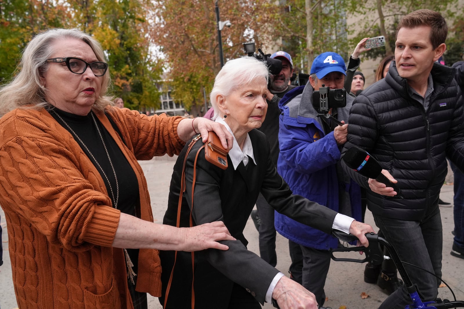 Erik and Lyle Menendez's aunt Joan VanderMolen, center, arrives at a courthouse to attend a hearing in Los Angeles, Monday, Nov. 25, 2024. (AP Photo/Jae C. Hong)