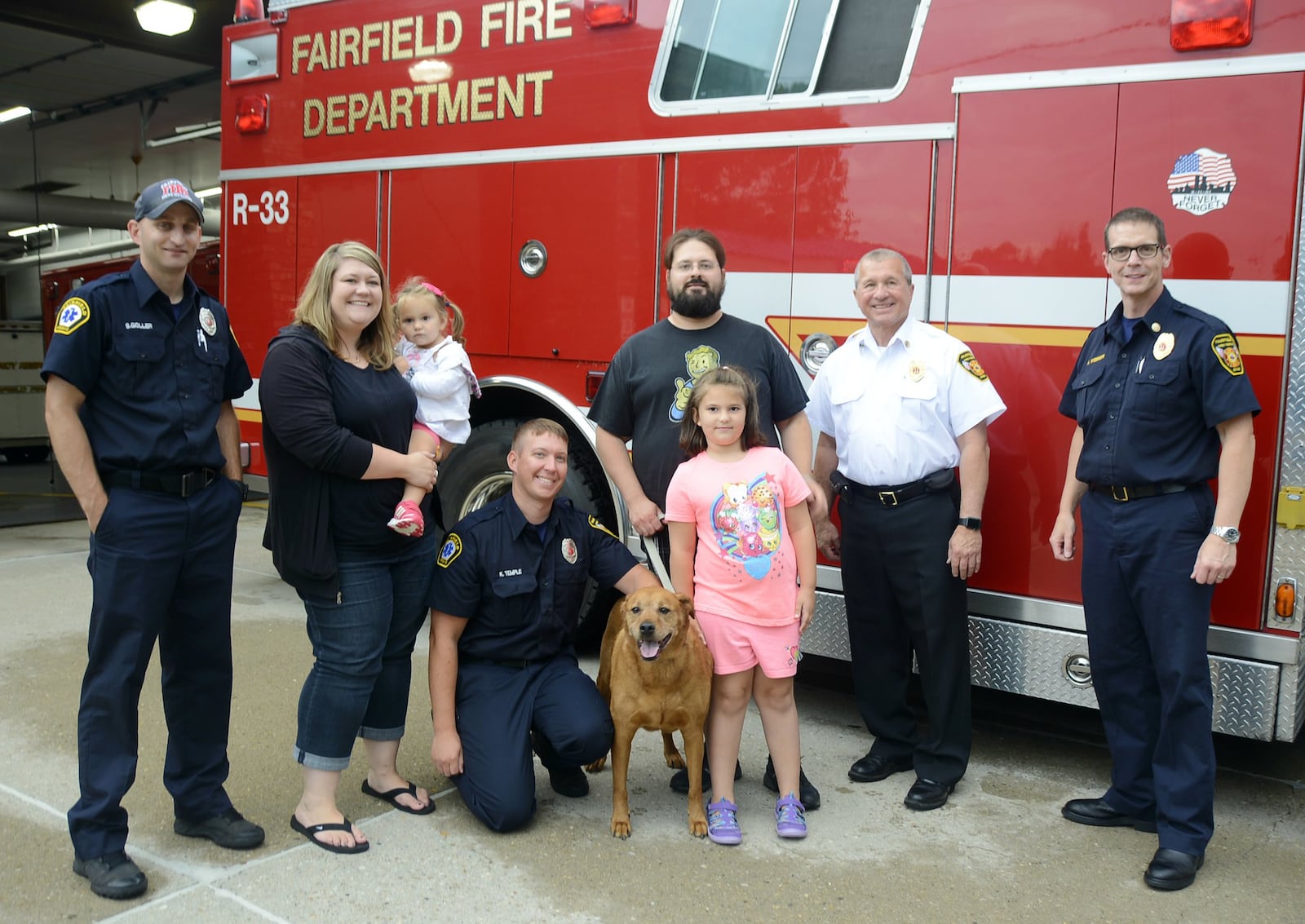 The crew from Rescue 33 at the fire station on Winton Road in Fairfield was dispatched to rescue Conrad, a 9-year-old Golden Retriever, Labrador and Ridgeback mix. The Pellegrino family visited that fire station on July 20 and thanked the crew that saved their dog. MICHAEL D. PITMAN/STAFF