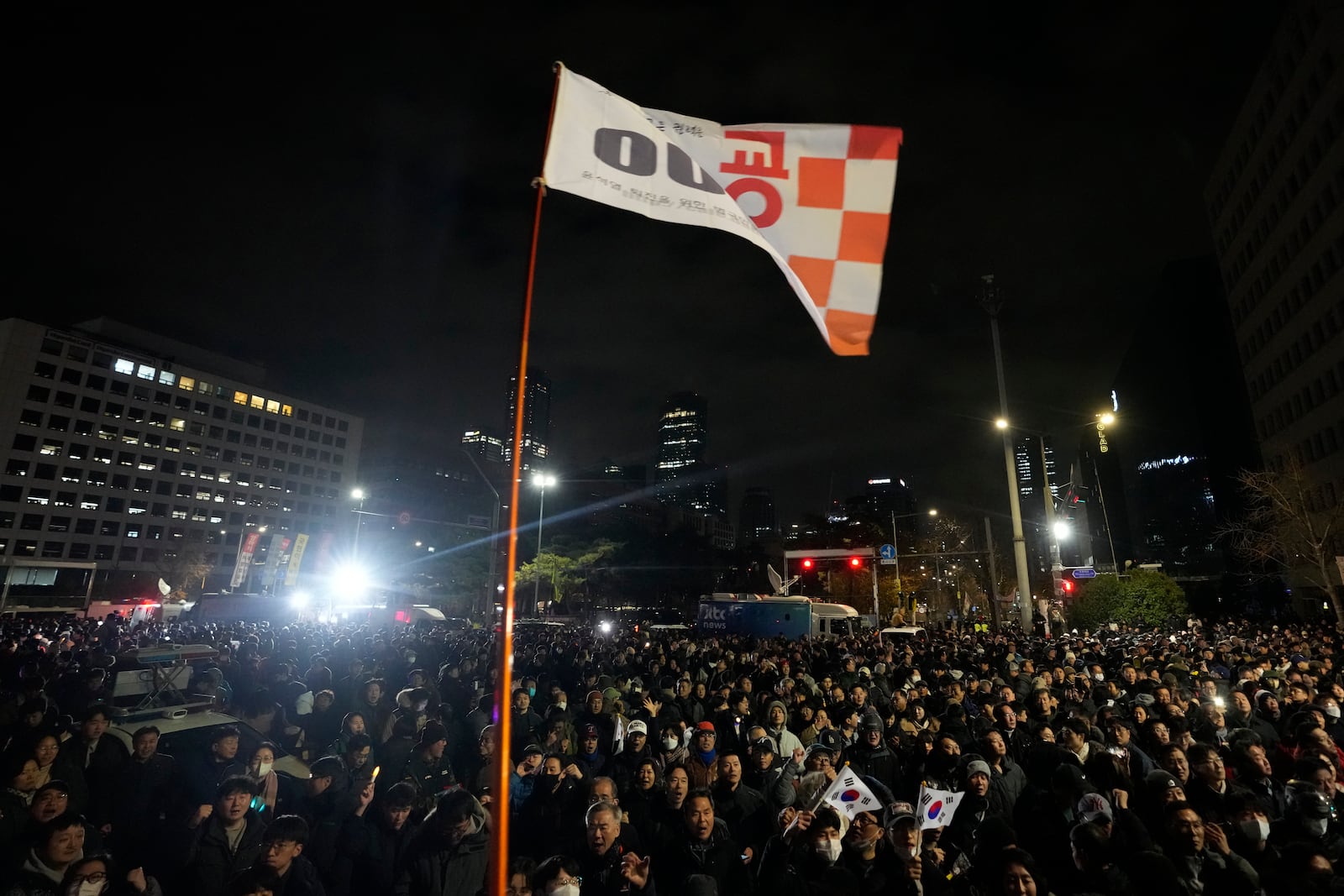 People gather in front of the National Assembly in Seoul, South Korea, Wednesday, Dec. 4, 2024. (AP Photo/Ahn Young-joon)