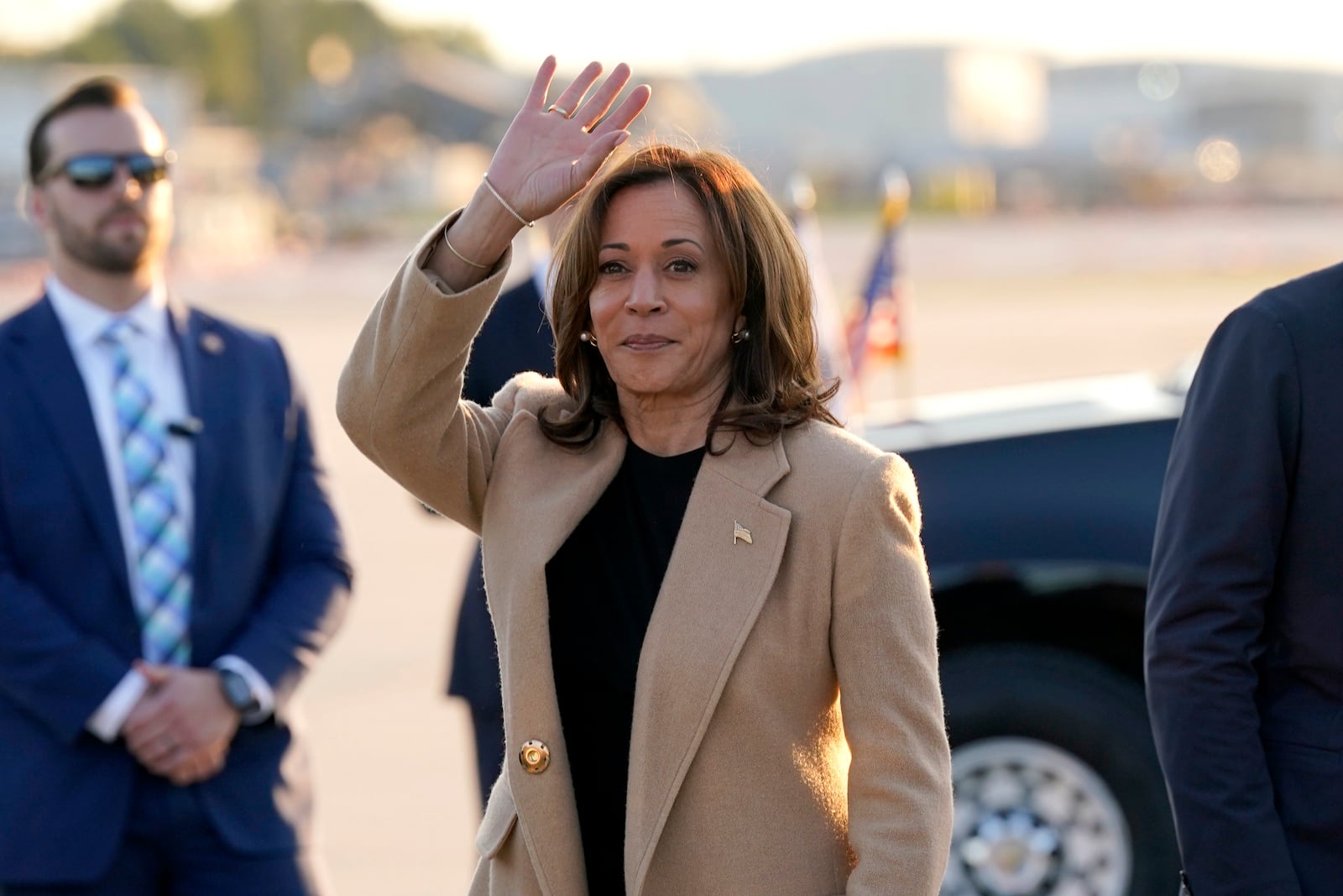 Democratic presidential nominee Vice President Kamala Harris waves as she arrives at Raleigh-Durham International Airport in Morrisville, N.C., Saturday, Oct. 12, 2024. (AP Photo/Steve Helber)