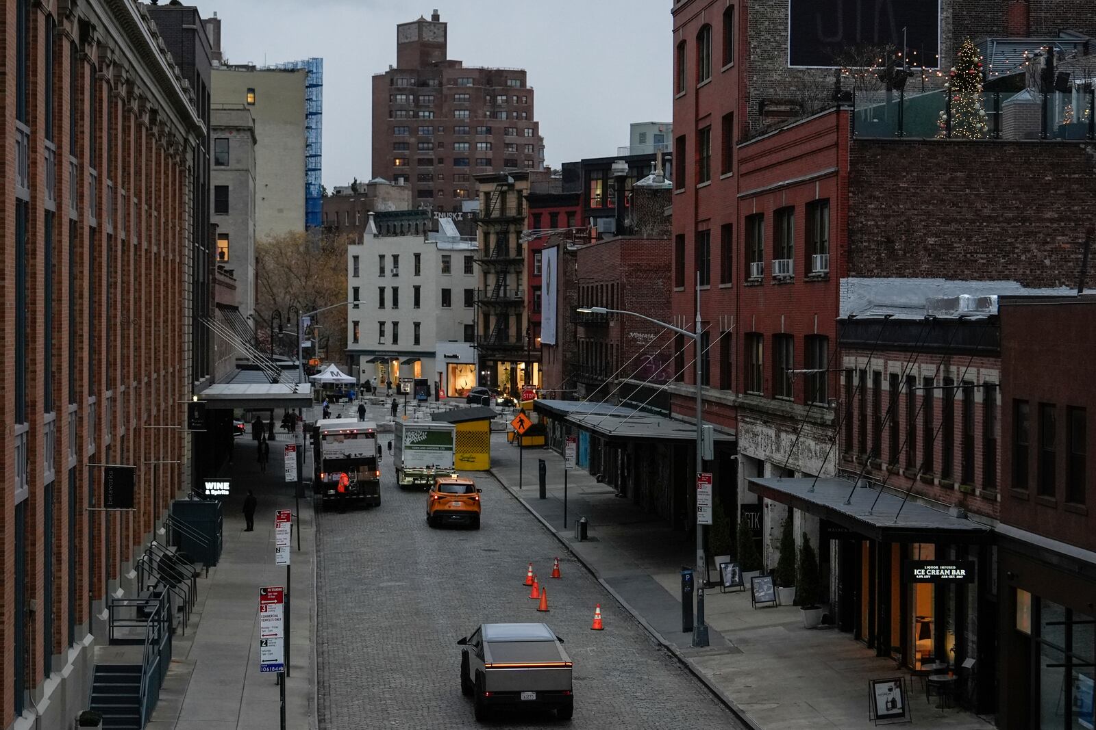 A Tesla Cybertruck drives through the Meatpacking District of Manhattan, Friday, Nov. 22, 2024, in New York. (AP Photo/Julia Demaree Nikhinson)