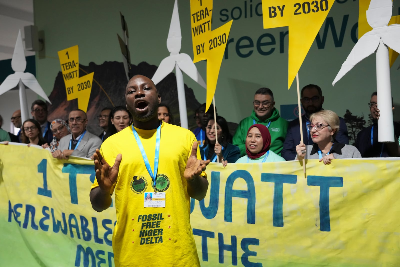 Activist Friday Barilule Nbani leads a demonstration for clean energy at the COP29 U.N. Climate Summit, Monday, Nov. 18, 2024, in Baku, Azerbaijan. (AP Photo/Sergei Grits)