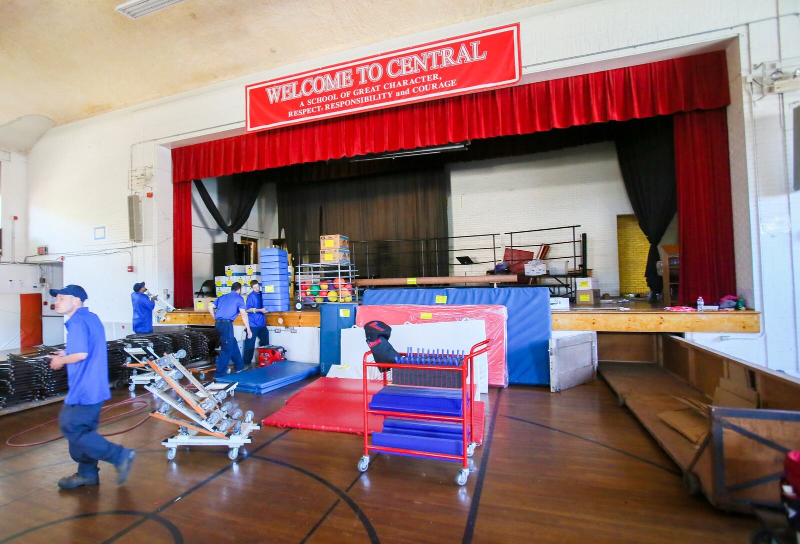 Crews from Planes Moving and Storage remove items from Fairfield Central Elementary on Tuesday, May 23. The building — Butler County’s second-oldest school — will be demolished in June. 