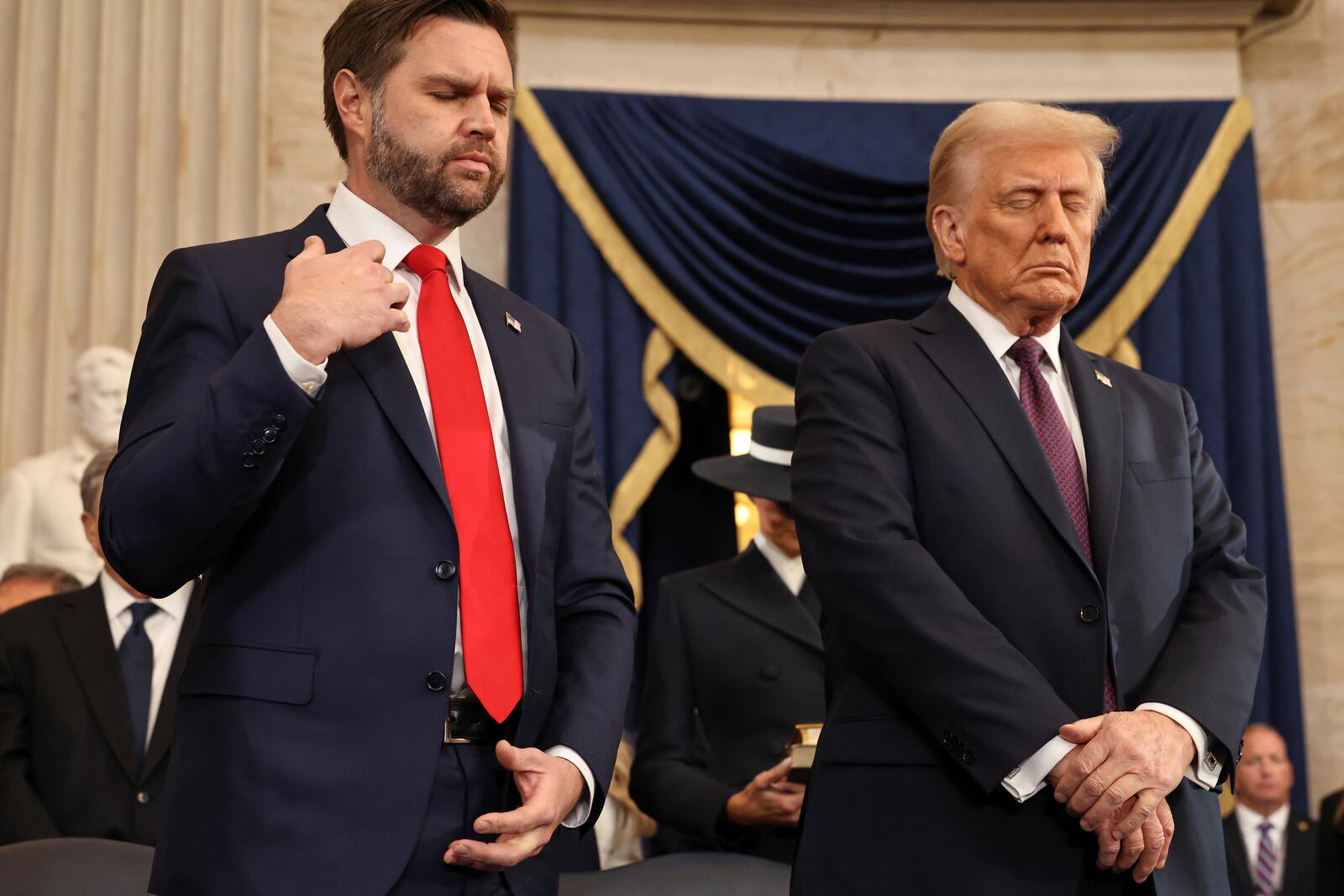 Vice President-elect former Sen. J.D. Vance, R-Ohio, left, and President-elect Donald Trump pray during the 60th Presidential Inauguration in the Rotunda of the U.S. Capitol in Washington, Monday, Jan. 20, 2025. (Chip Somodevilla/Pool Photo via AP)