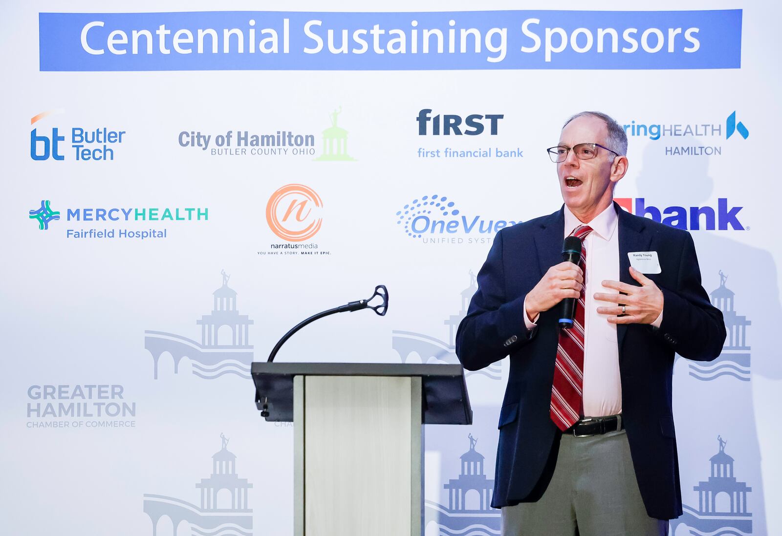 Ron Young, owner and CEO of Aglamesis Bros. ice cream and chocolate, tells the histroy of their business during the Greater Hamilton Chamber of Commerce annual meeting Friday, Jan. 31, 2025 at Spooky Nook Sports Champion Mill in Hamilton. David Stark was honored as Hamilton Citizen of the Year and Kirsten Spicer was honored as Small Business Person of the Year. NICK GRAHAM/STAFFNICK GRAHAM/STAFF