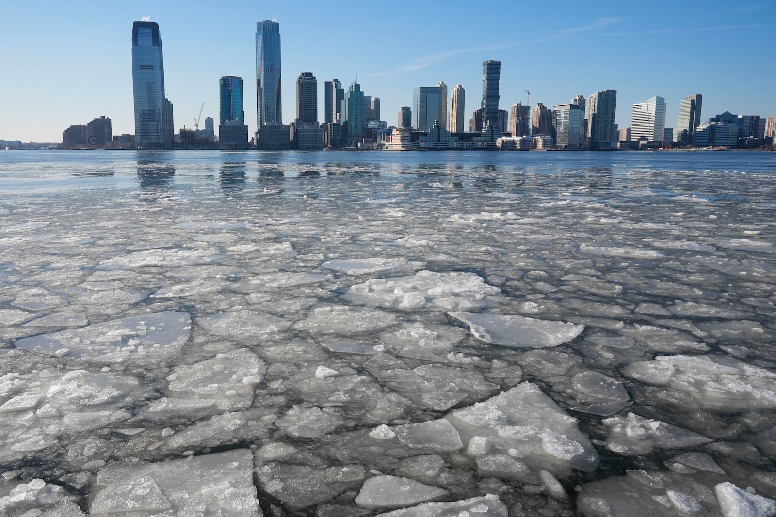 New Jersey is seen behind ice floating on the Hudson River in New York, Wednesday, Jan. 22, 2025. (AP Photo/Seth Wenig)