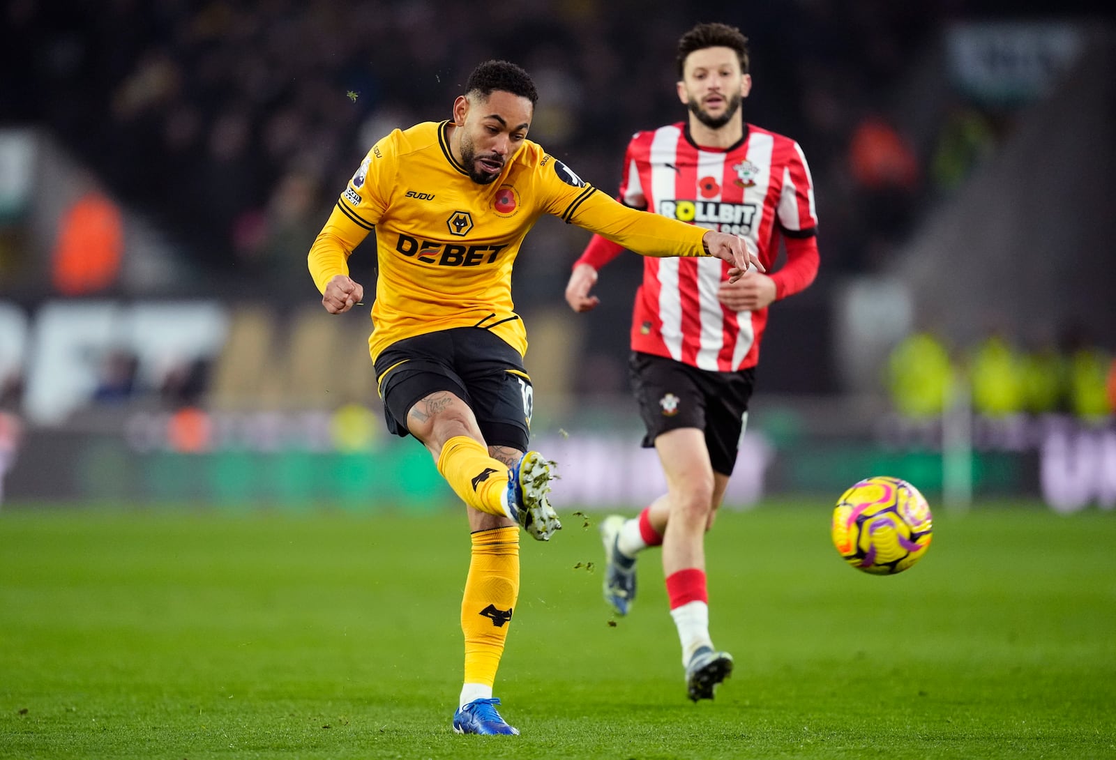 Wolverhampton Wanderers' Matheus Cunha scoring his sides second goal during the British Premier League soccer match between Wolverhampton Wanderers and Southampton, at Molineux, Wolverhampton, England, Saturday Nov. 9, 2024. (Nick Potts/PA via AP)