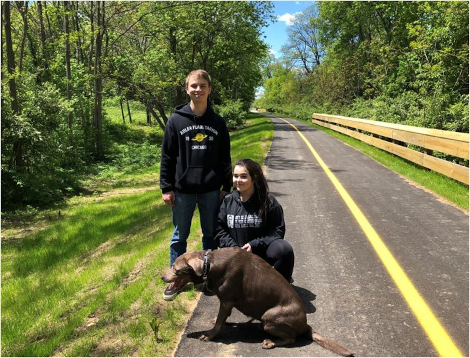 Joseph Wegman, Bella Herron and their dog, Murphy, enjoy the Beltline bike/hike path last week. MIKE RUTLEDGE / STAFF