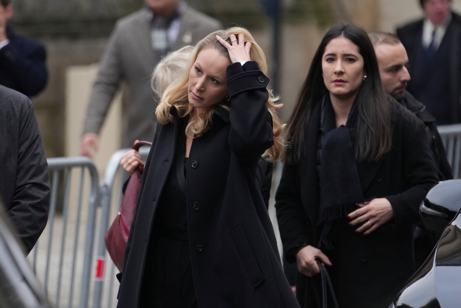 Marion Marechal, center, arrives at Notre Dame du Val-de-Grace church for a public memorial for her grand-father and late far-right leader Jean-Marie Le Pen, Thursday, Jan. 16, 2025 in Paris. Jean-Marie Le Pen, the founder of France's main far-right party, died on Jan.7, 2025 aged 96. (AP Photo/Thibault Camus)