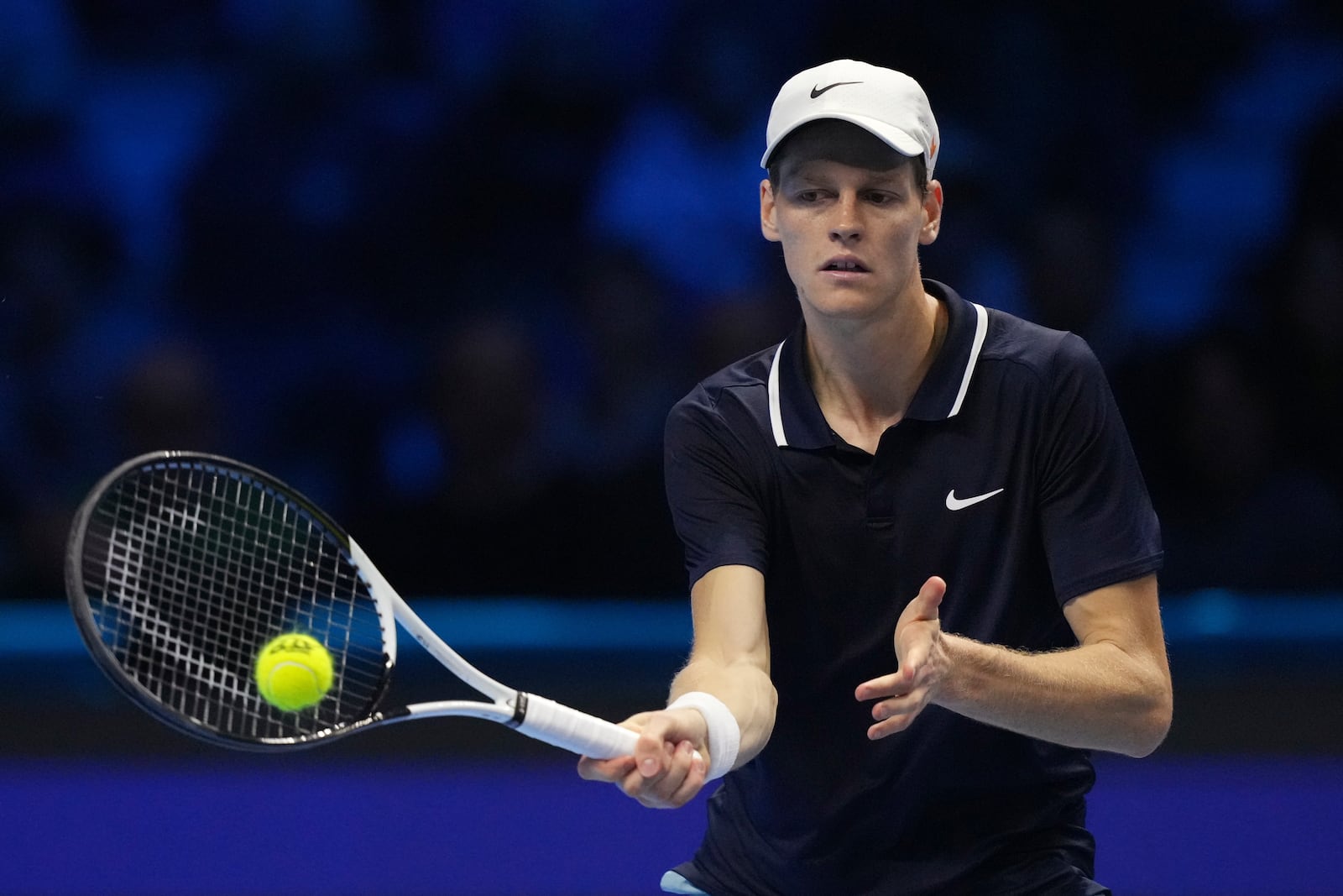 Italy's Jannik Sinner returns the ball to United States' Taylor Fritz during their singles tennis match of the ATP World Tour Finals at the Inalpi Arena, in Turin, Italy, Tuesday, Nov. 12, 2024. (AP Photo/Antonio Calanni)