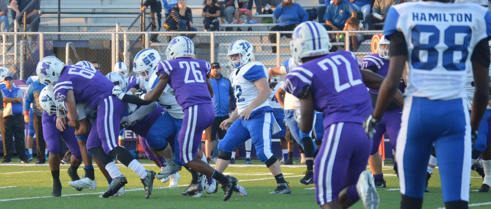 Middletown’s Gene Underhill (66) is among the defenders trying to get a handle on Hamilton’s Maleek Jarrett (8) during a game at Barnitz Stadium in Middletown on Sept. 29, 2017. Visiting Big Blue won 47-26. CONTRIBUTED PHOTO BY MARITZA MCKINNEY