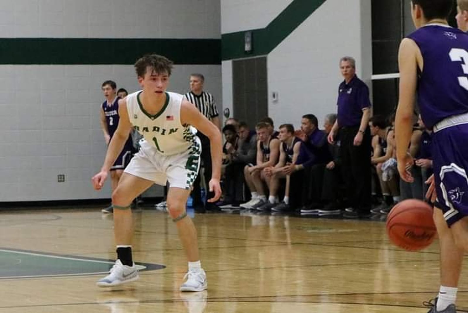 Badin’s Joseph Walsh (1) defends Elder’s Willard Cluxton (3) on Tuesday night at Mulcahey Gym in Hamilton. Badin earned a 57-53 win. CONTRIBUTED PHOTO BY TERRI ADAMS