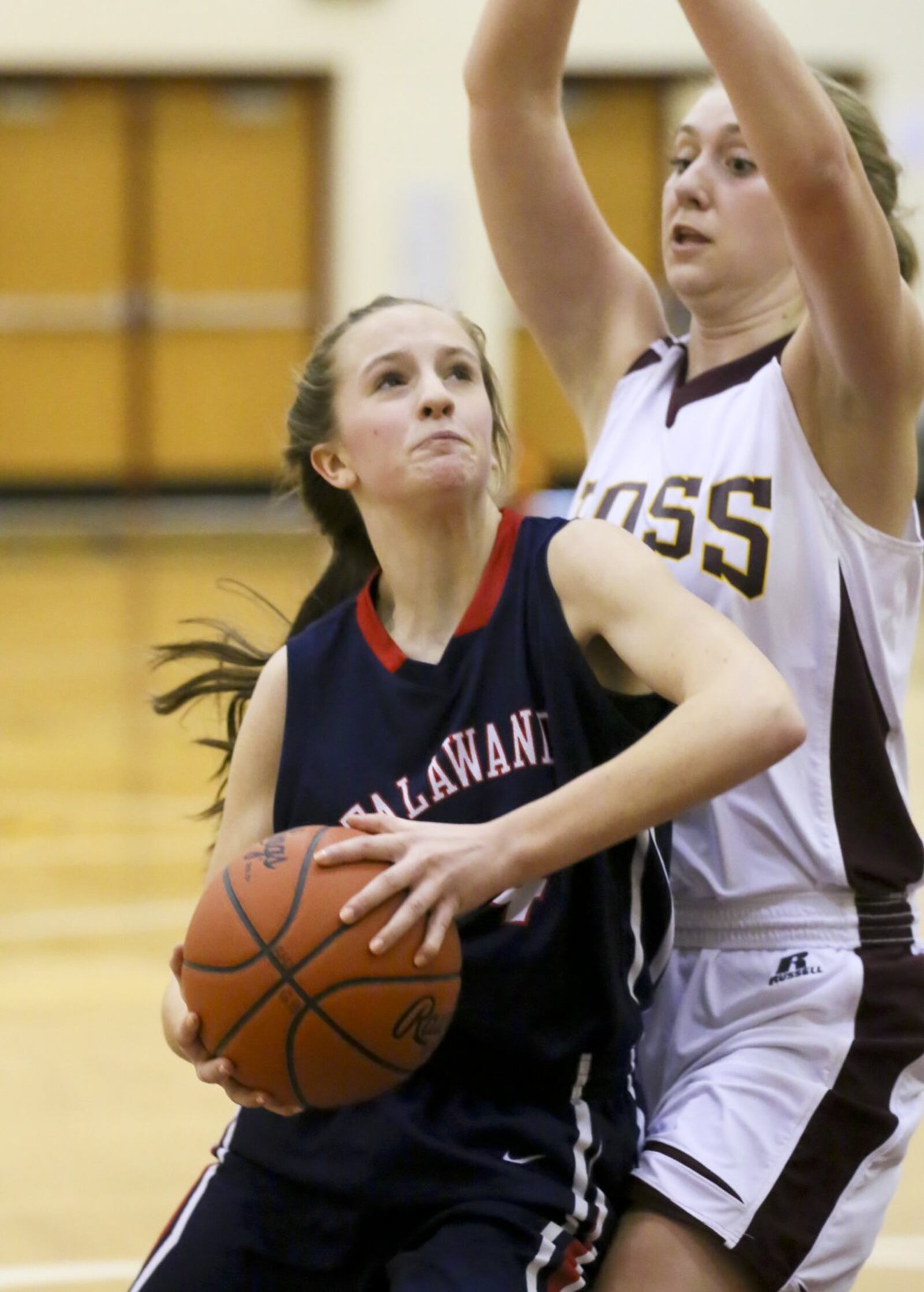 Talawanda guard Addie Brown (14) looks to take a shot past Ross defender Katie Brehm (21) during their game at Ross on Feb. 14, 2015. GREG LYNCH/STAFF