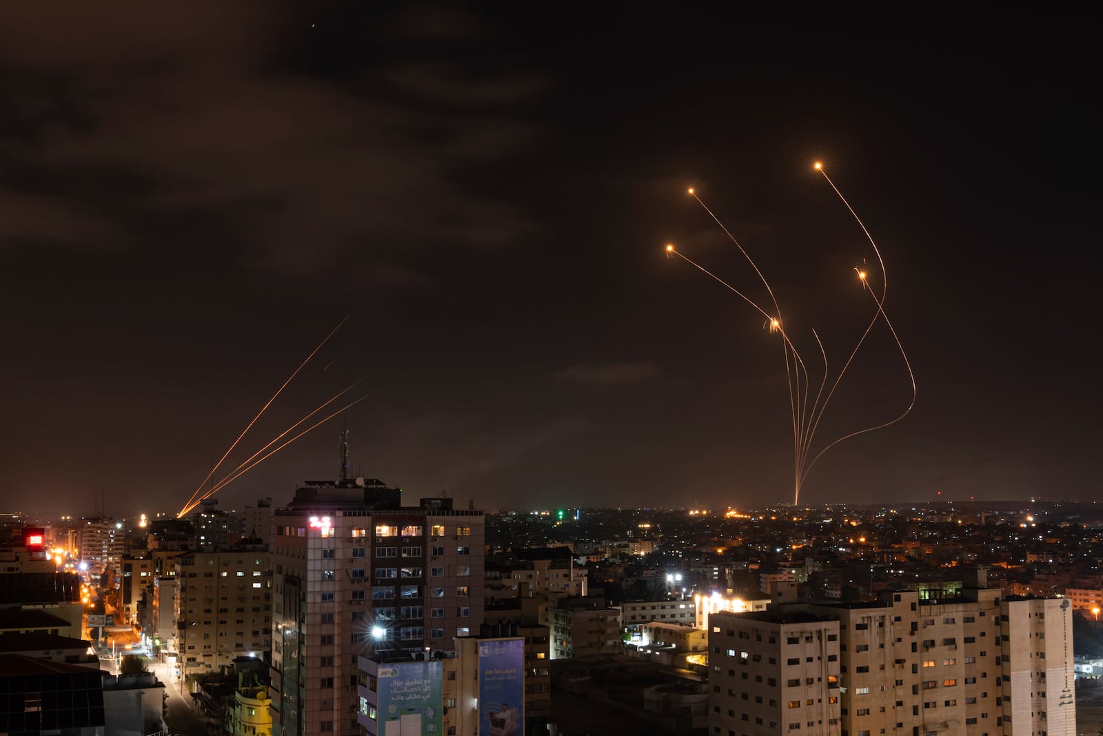 FILE - Rockets fired from Gaza and intercepted by Israel's Iron Dome anti-missile system over Israeli skies are seen from Gaza City, on May 13, 2023. (AP Photo/Fatima Shbair, File)