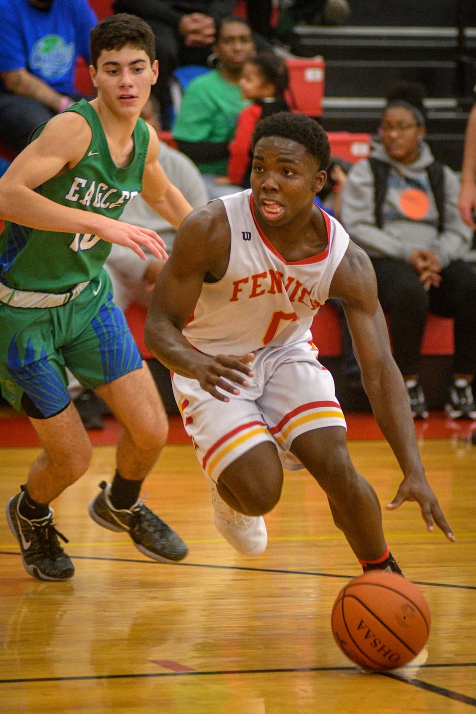 Fenwick’s Caleb Davis dribbles around Chaminade Julienne’s Jack Nauseef during Friday night’s game in Middletown. CJ won 68-63 in double overtime. ROB MCCULLEY/RAM PHOTOGRAPHY