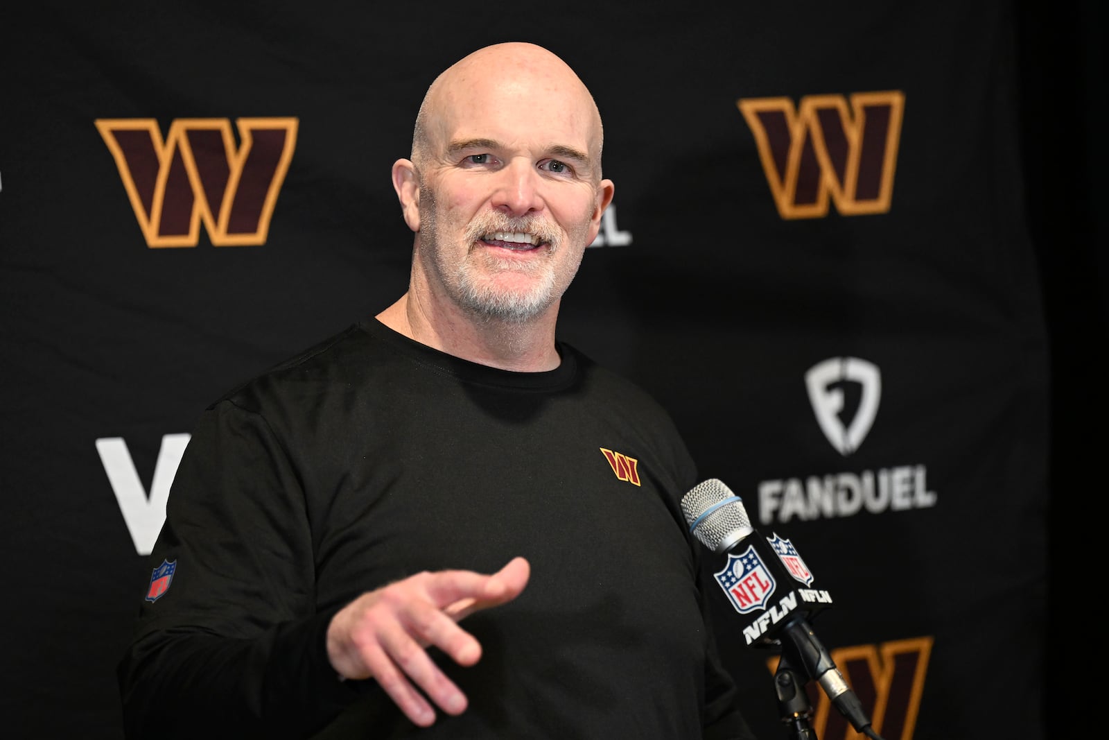 Washington Commanders head coach Dan Quinn speaks at a news conference after an NFL wild-card playoff football game against the Tampa Bay Buccaneers in Tampa, Fla., Sunday, Jan. 12, 2025. (AP Photo/Jason Behnken)