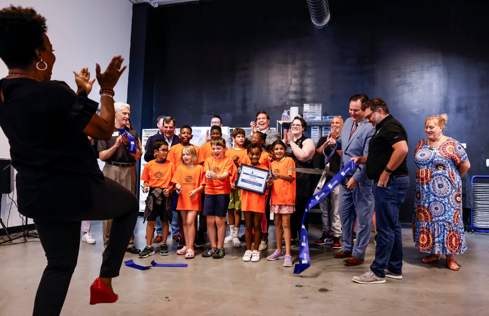 A ribbon cutting was held for the new Fitton at the Foundry studio space at Liberty Center Tuesday, July 30, 2024. A large crowd of local elected officials, kids from Boys & Girls Club of West Chester and others filled the first ever satellite location for Fitton Center for Creative Arts. NICK GRAHAM/STAFF