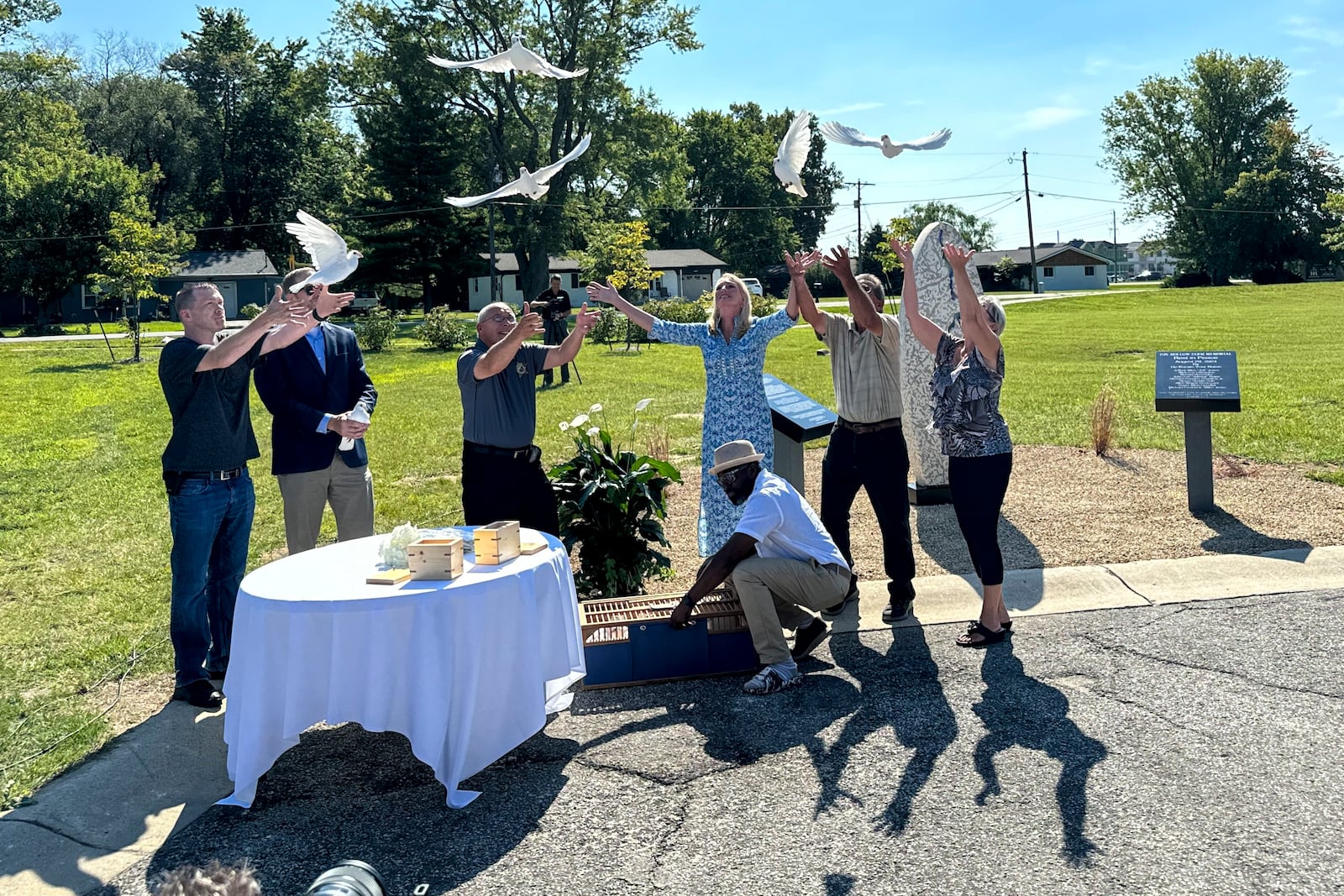 White doves are released on Aug. 29, 2024, in Westfield, Indiana, during the dedication of a memorial to the nine known victims of suspected serial killer Herbert Baumeister. (AP Photo/Rick Callahan)