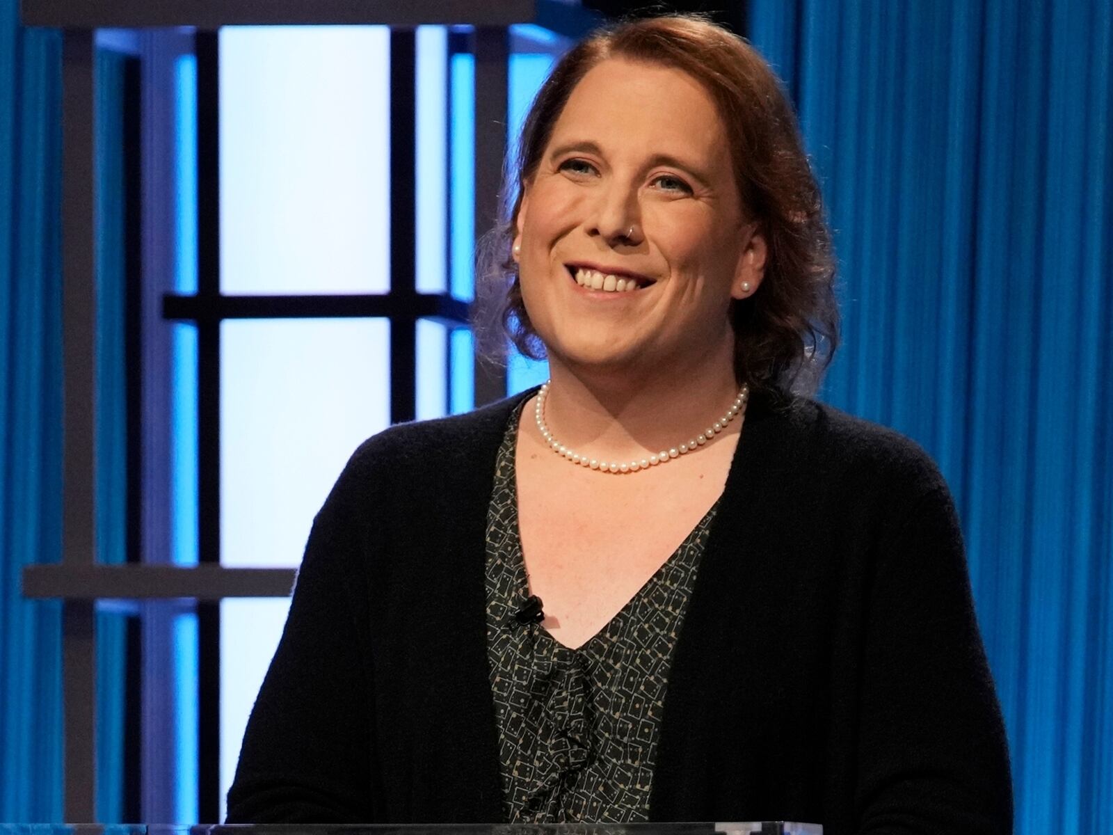 This image provided by Jeopardy Productions, Inc. shows game show champion Amy Schneider on the set of "Jeopardy!" Schneider is the first trans person to qualify for the show's Tournament of Champions. (Jeopardy Productions, Inc. via AP)