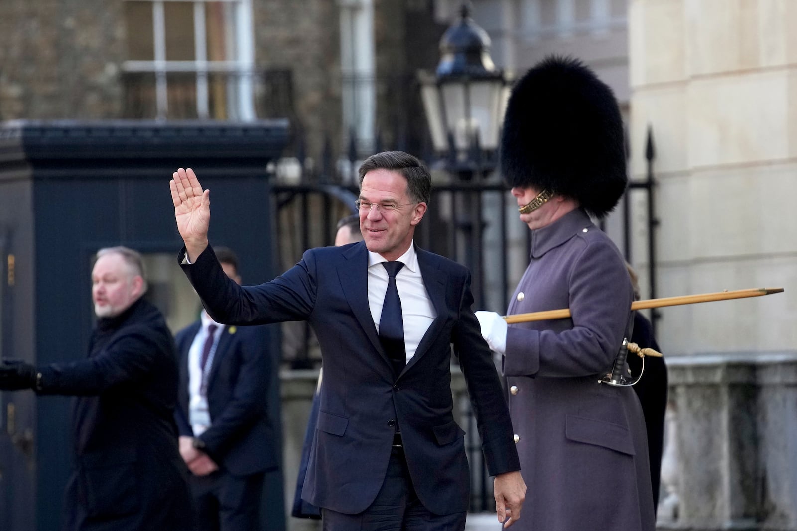 NATO Secretary General Mark Rutte waves as he arrives for a summit on Ukraine at Lancaster House in London, Sunday, March 2, 2025. (AP Photo/Christophe Ena, Pool)