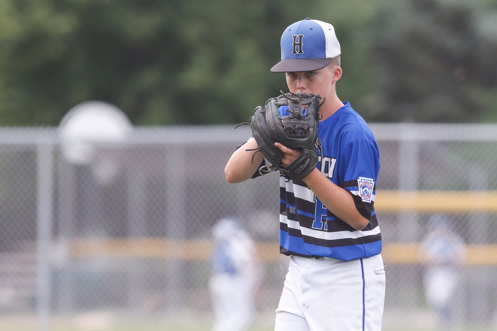 Hamilton West Side’s Davis Avery prepares to throw a pitch during Thursday’s winners’ bracket final against Canfield in the Ohio Little League 12-year-old baseball tournament at Ford Park in Maumee. CONTRIBUTED PHOTO BY SCOTT GRAU