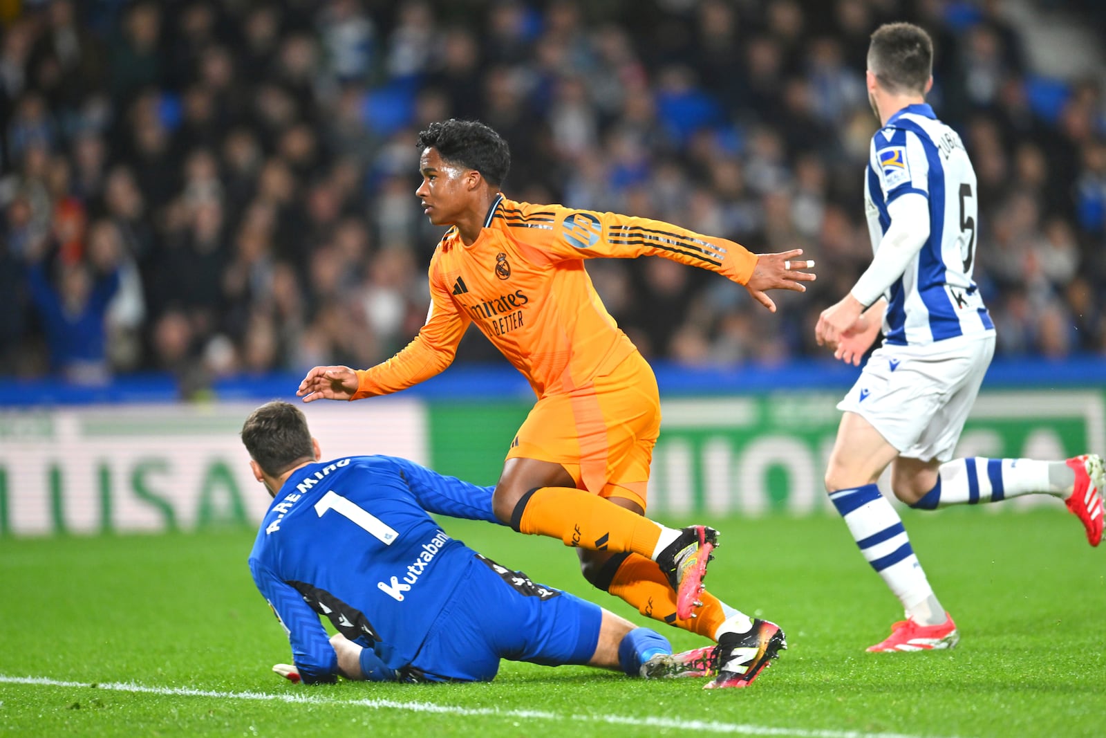 Real Madrid's Endrick, centre, scores his side's opening goal during the Spanish Copa del Rey soccer match between Real Sociedad and Real Madrid at the Reale Arena in San Sebastian, Spain, Wednesday, Feb. 26, 2025. (AP Photo/Miguel Oses)