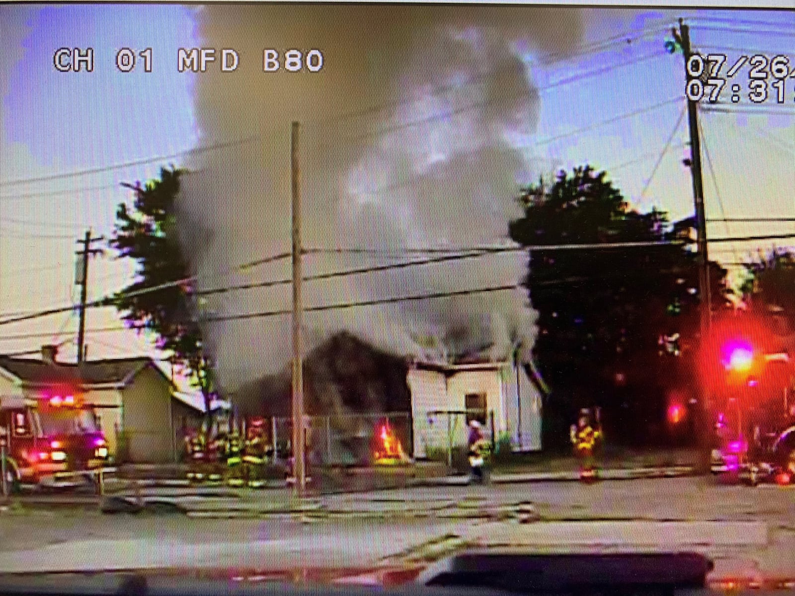 A woman was trapped inside this burning Middletown residence on July 26 and she was carried to safety by two Middletown police officers. MIDDLETOWN DIVISION OF FIRE