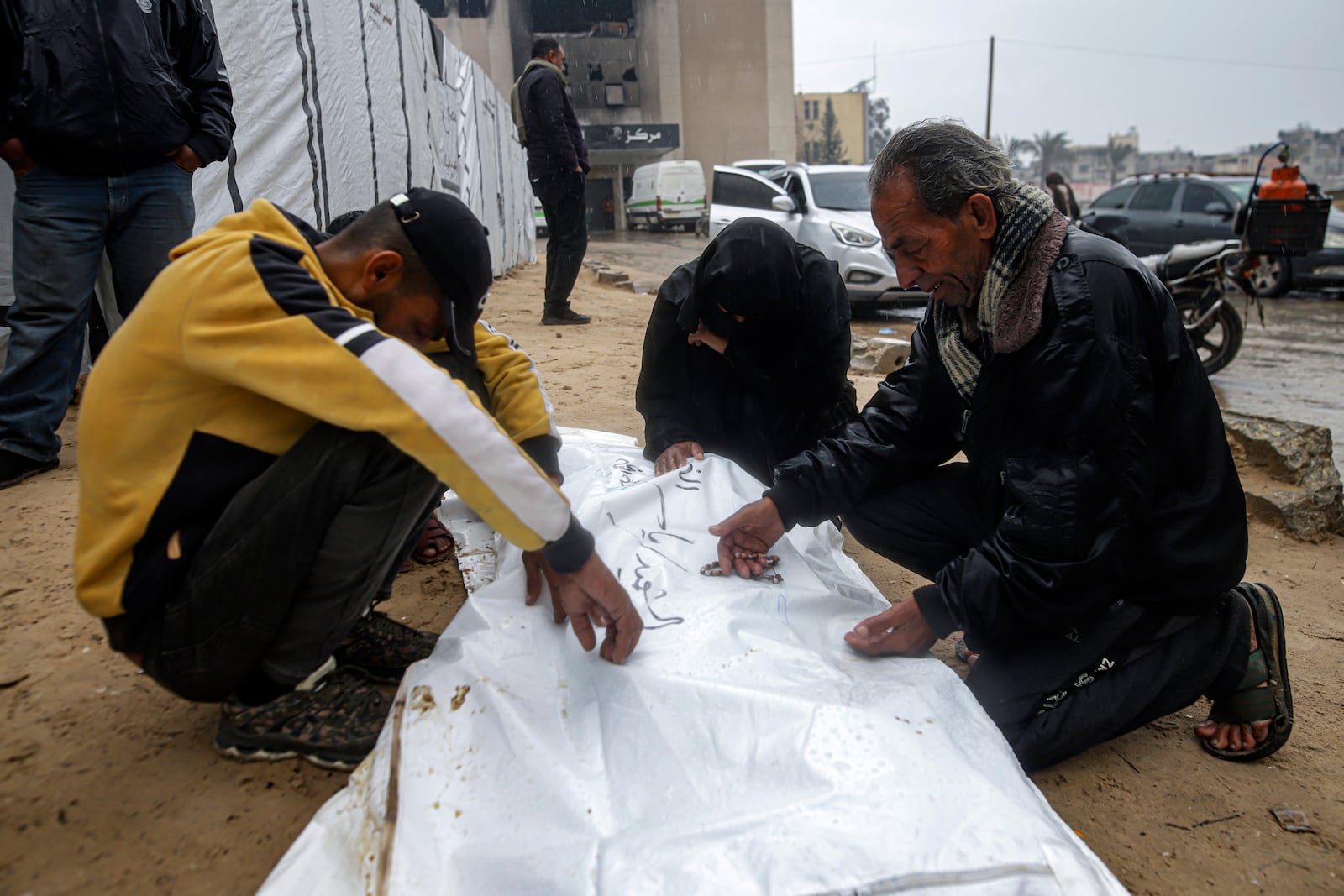 Palestinians mourn a relative who was killed in the Israeli bombardment of the Gaza Strip, at the Nasser hospital in Khan Younis, Southern Gaza Strip, Thursday, Jan. 23, 2025. (AP Photo/Jehad Alshrafi)