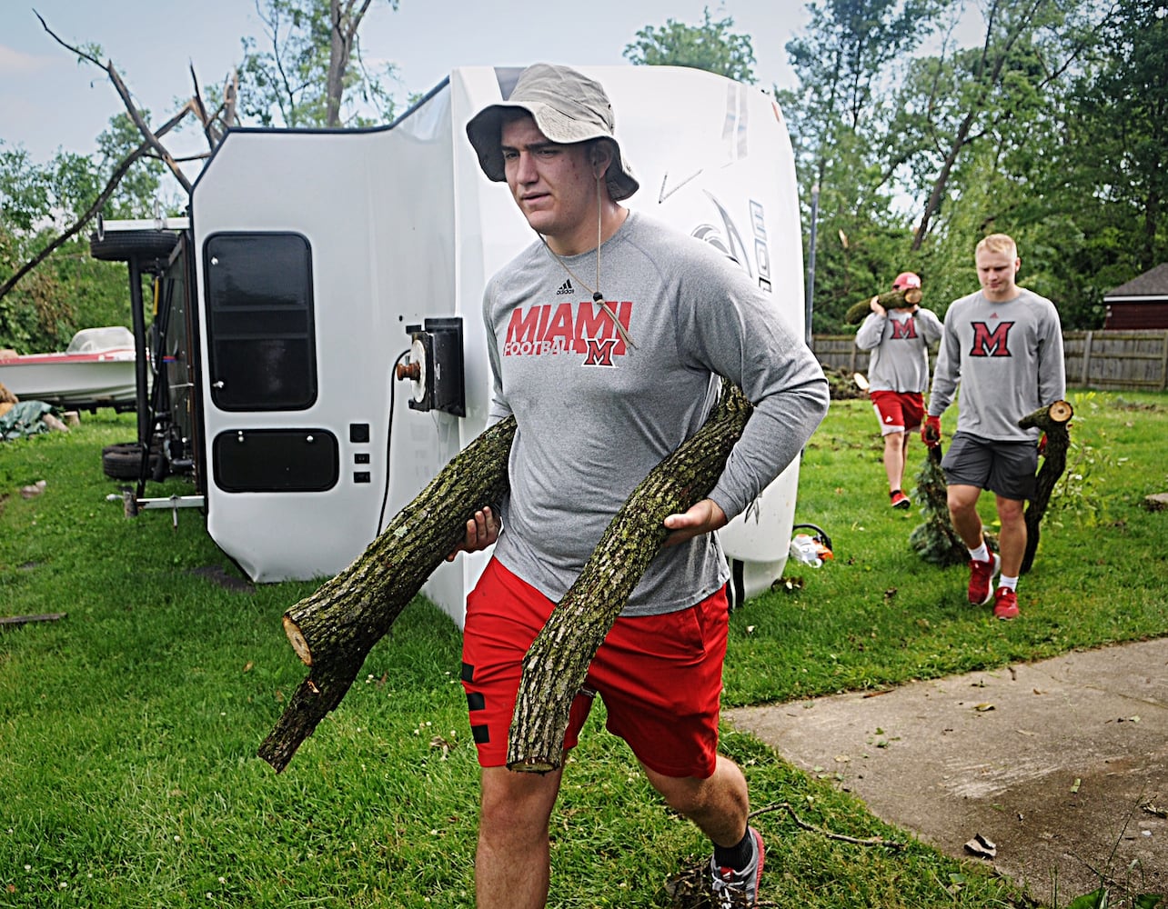 PHOTOS: Tornado-damaged communities dig out, clean up