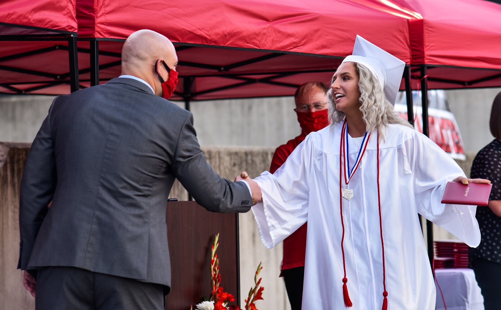 Madison High School drive-thru graduation ceremony at Land of Illusion