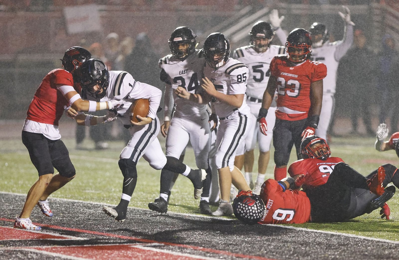 Lakota East quarterback TJ Kathman carries the football in for a touchdown during their 34-7 loss to Lakota West Friday, Oct. 22, 2021 at Lakota West High School in West Chester Township. NICK GRAHAM/STAFF