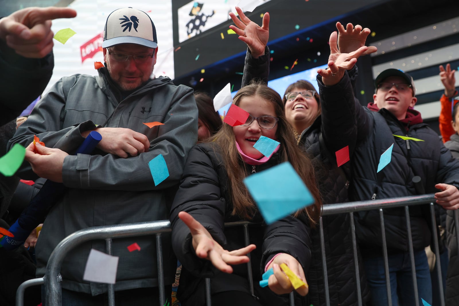 People in the crowd catch confetti ahead of New Year's Eve in Times Square, Sunday, Dec. 29, 2024, in New York. (AP Photo/Heather Khalifa)