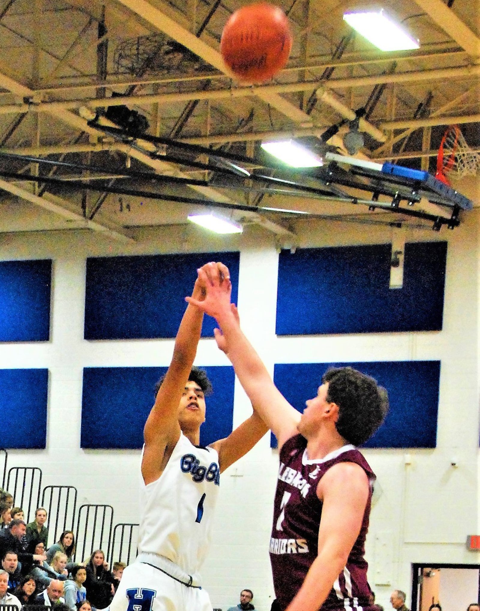 Lebanon’s Zach Huffman defends a shot by Hamilton’s Trey Robinson during Friday night’s game at Garfield Middle School in Hamilton. Host Big Blue won 48-47. CONTRIBUTED PHOTO BY OLIVER SANDERS