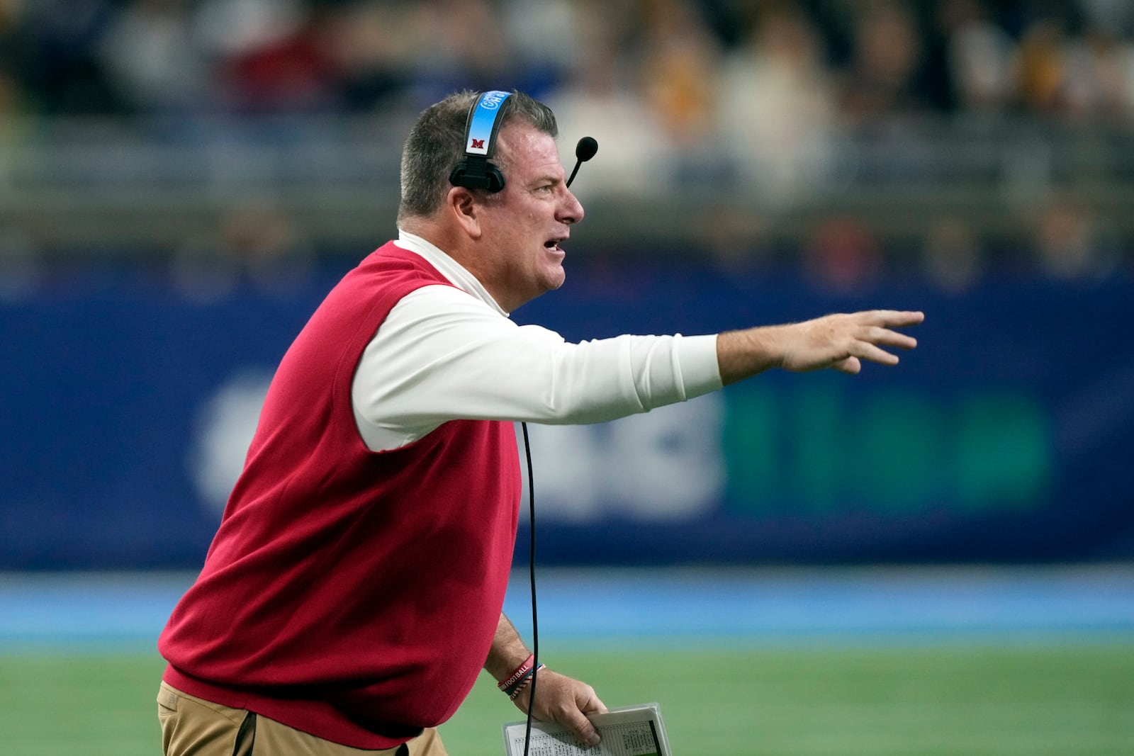 FILE - Miami (Ohio) head coach Chuck Martin directs from the sideline during the first half of the Mid-American Conference championship NCAA college football game against Toledo, Saturday, Dec. 2, 2023, in Detroit. (AP Photo/Carlos Osorio, File)