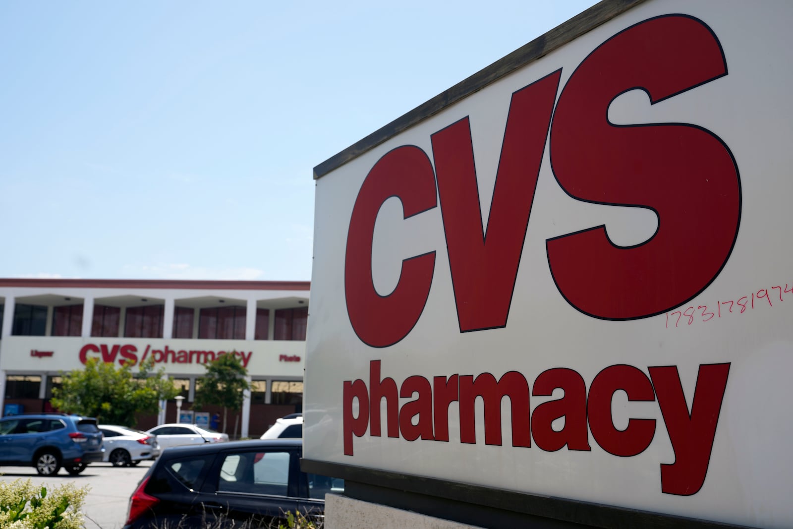 FILE - A sign marks a CVS branch on Tuesday, May 16, 2023, in Pasadena, Calif. (AP Photo/Marcio Jose Sanchez, File)